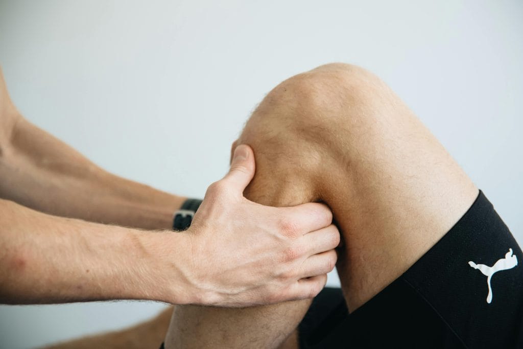 a person holding a knee